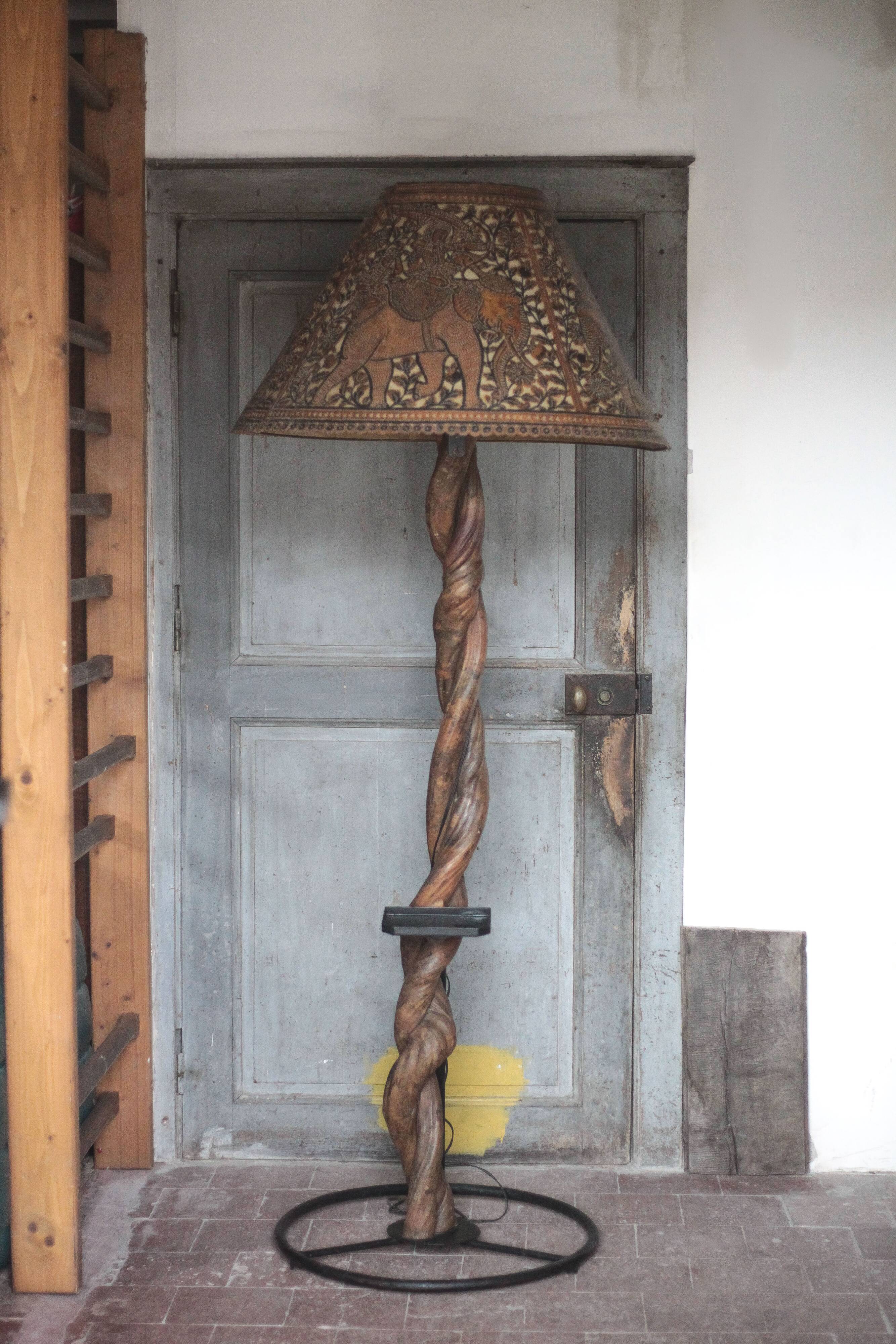 Liane and metal floor lamp with perforated leather shade featuring elephant patterns, lise.