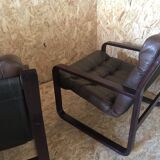 Pair of vintage armchairs in curved wood with suspended seat circa 1970-80.