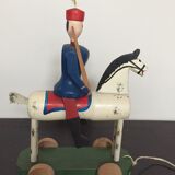Soldier on wooden horse to shoot