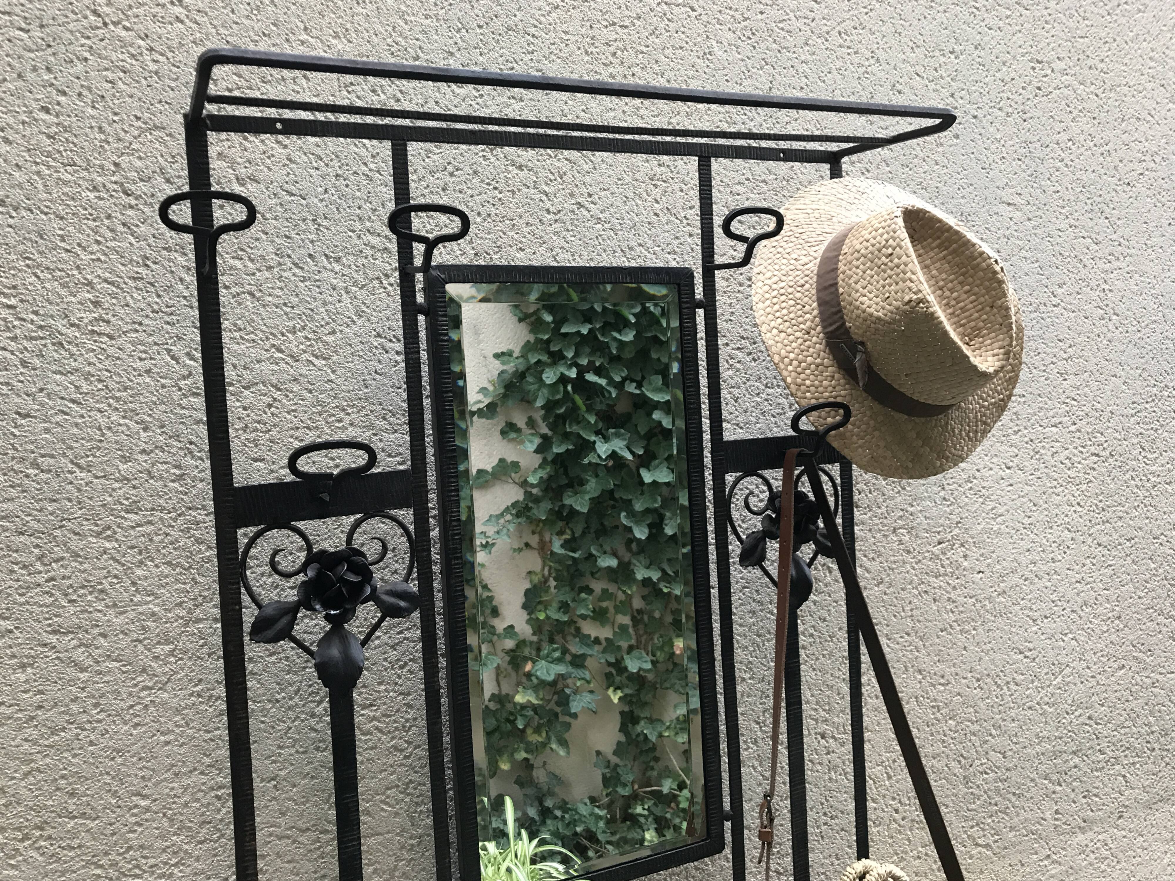 Wrought iron coat holder with 1930
