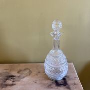 Blown glass decanter and relief decoration