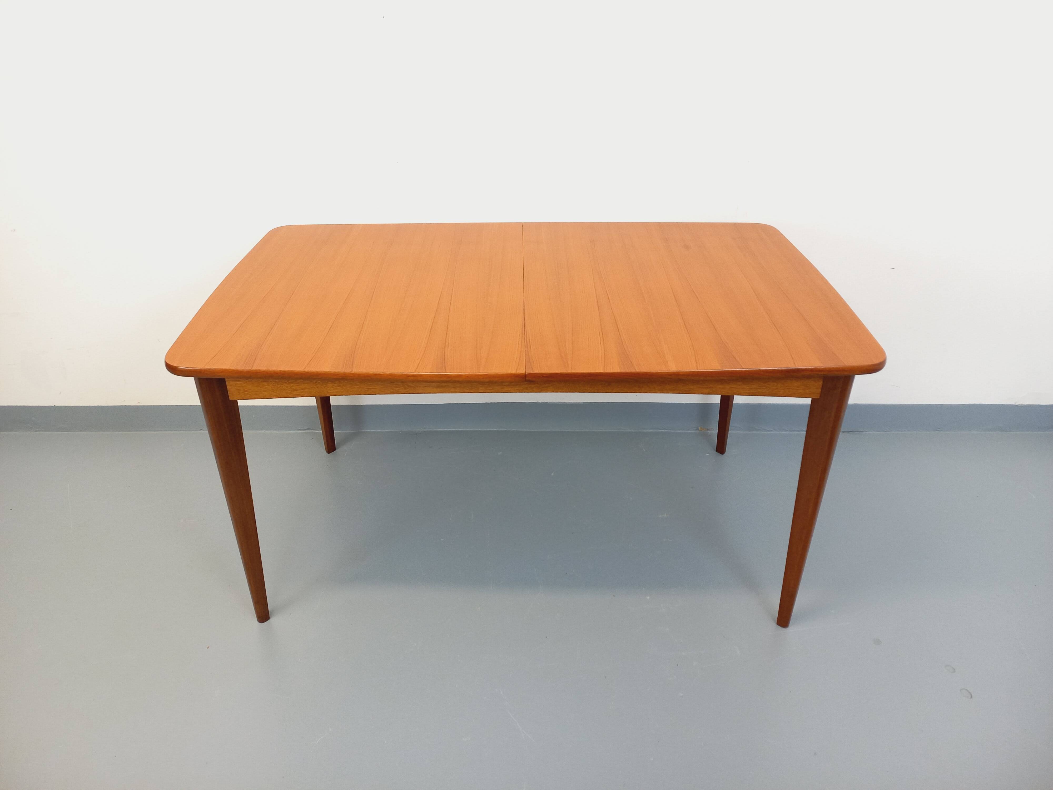 Rectangular dining table in vintage Scandinavian style from the 50s and 60s, made of teak.