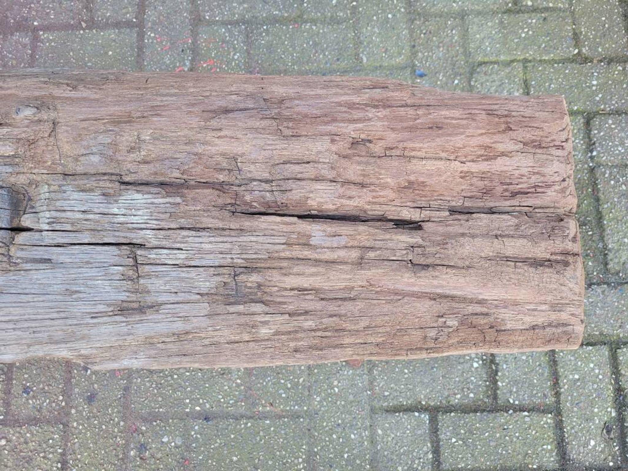 French country style cast iron bench with old rustic wooden plank