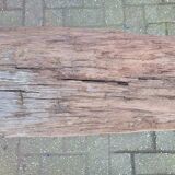 French country style cast iron bench with old rustic wooden plank