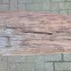 French country style cast iron bench with old rustic wooden plank