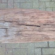 French country style cast iron bench with old rustic wooden plank