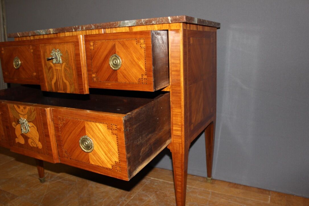 Louis XVI style chest of drawers with music attributes