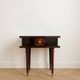 Vintage Art Deco bedside table in dark wood with gold details.