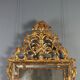 Antique mirror in gilded lime wood, Baroque sculptures, 18th century