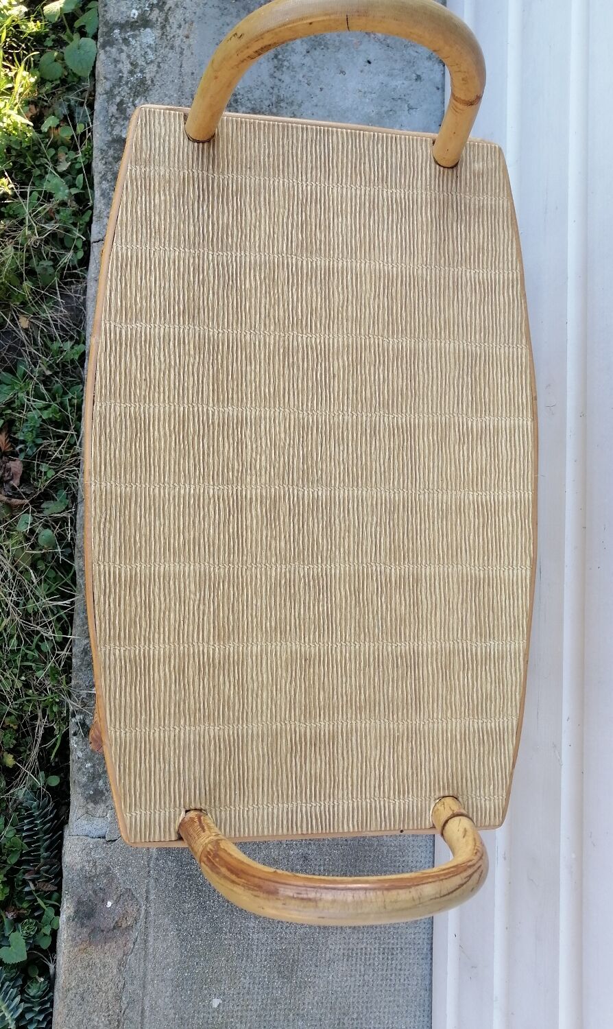 Rattan table at the end of the sofa