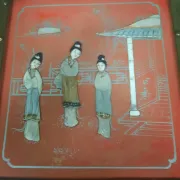 Red lacquered wooden mallet from the Far East.