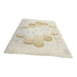 Large rug with flower decoration.