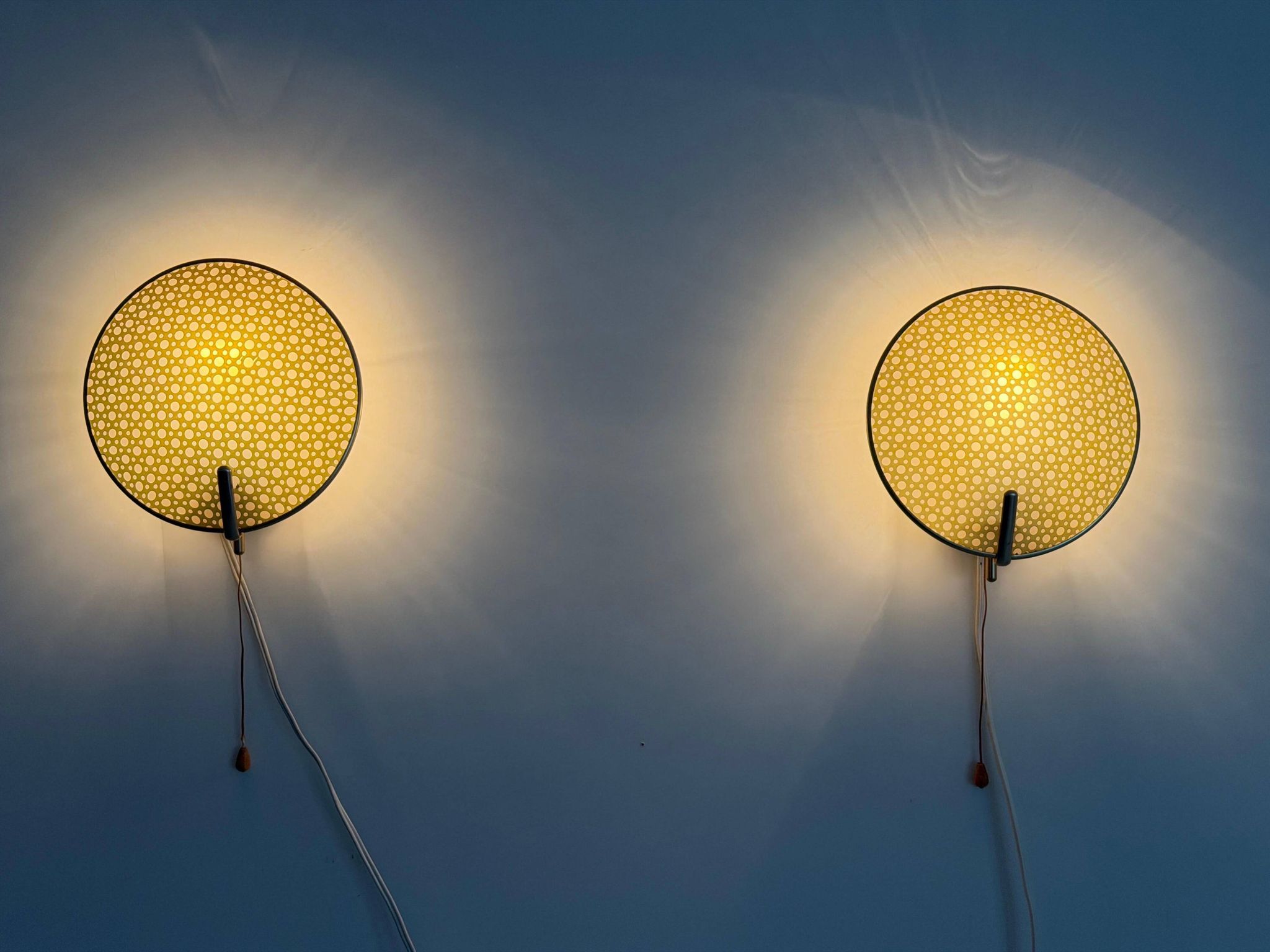 Pair of green plexiglass and gold metal wall lights by Erco, 1950s, Germany.