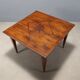 Antique Directoire table in walnut and cherry, Italy, 19th century.