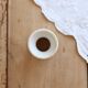 Old diabolo egg cup, ironstone with ivory and green pattern.