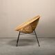 Round rattan lounge chair with black metal frame