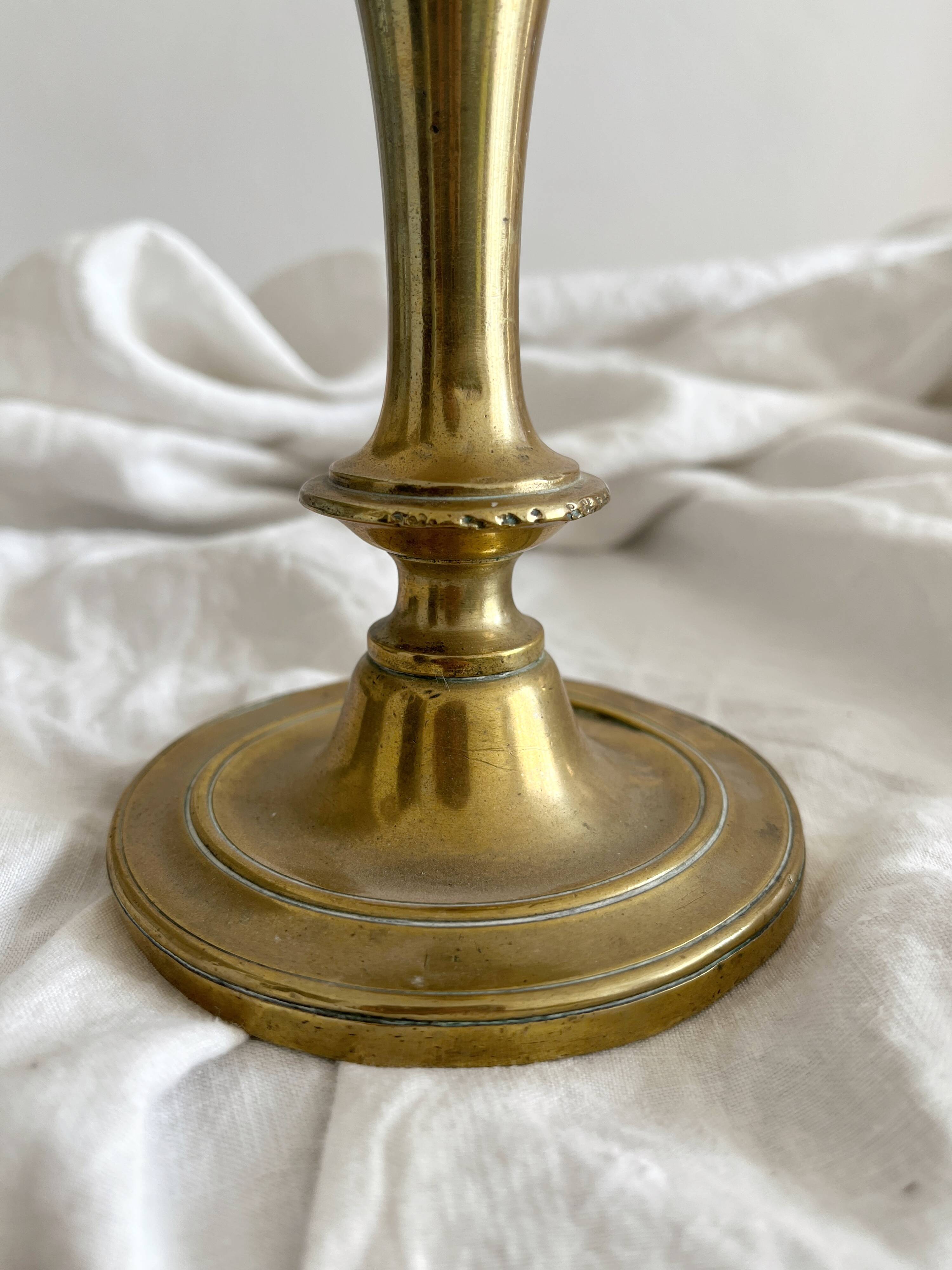 Antique brass candlestick in vintage baluster shape