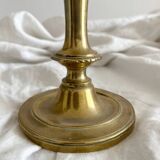 Antique brass candlestick in vintage baluster shape