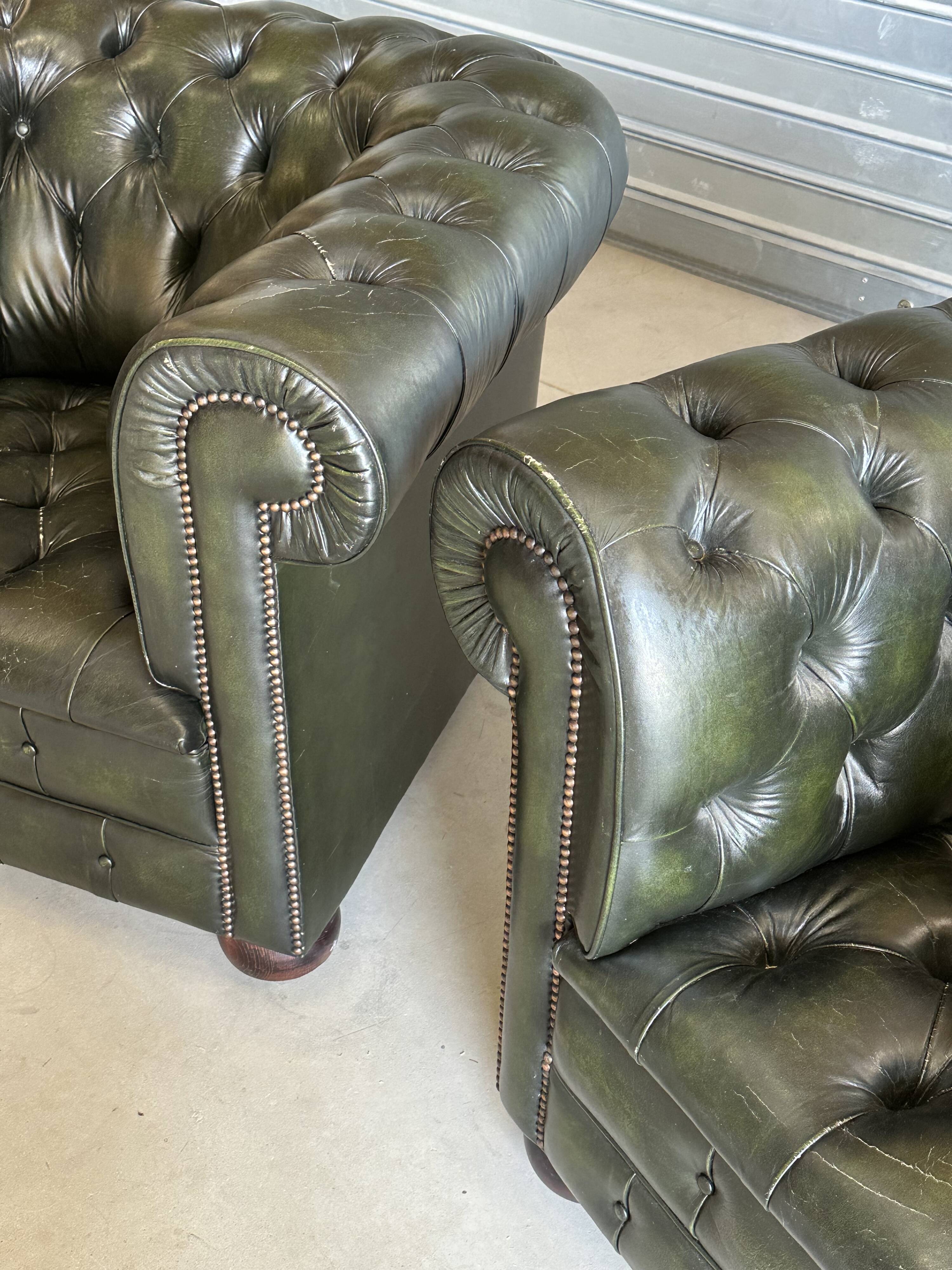 Title: Pair of vintage olive green leather Chesterfield armchairs