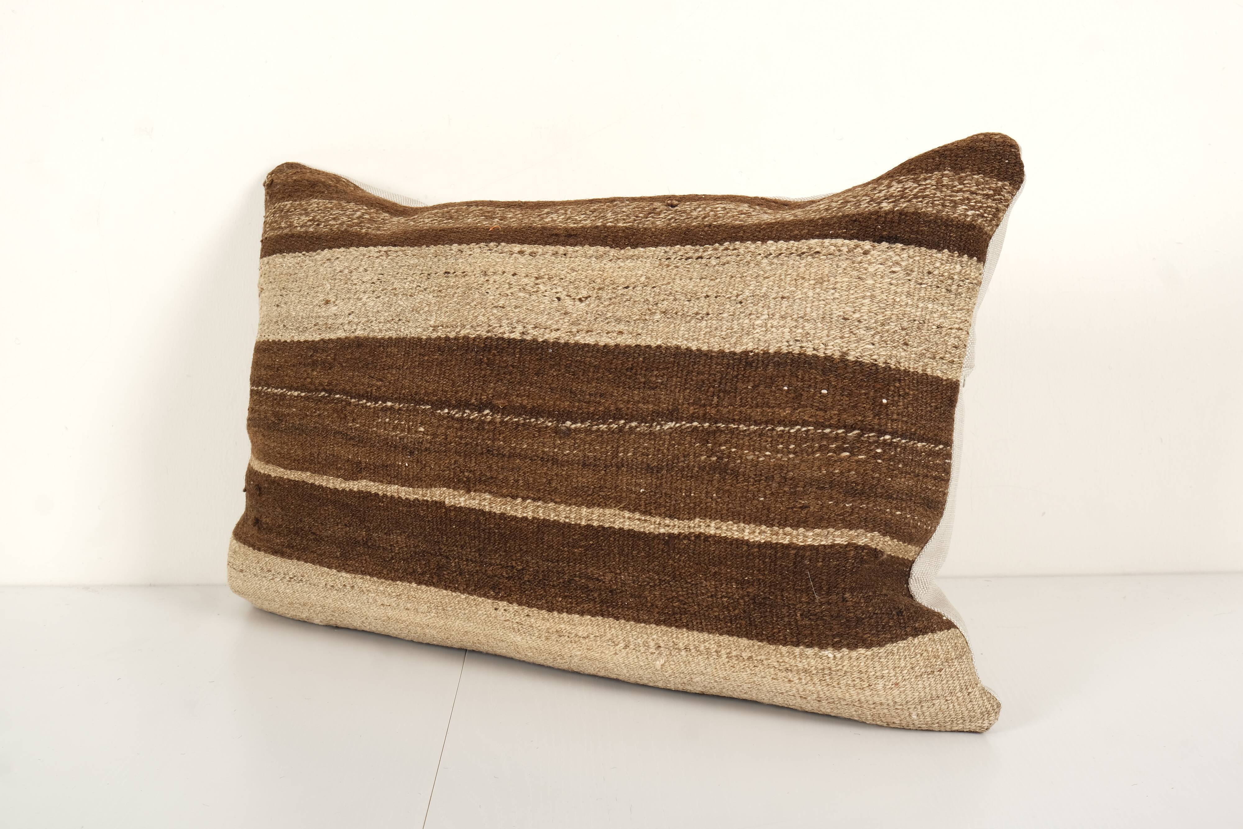 Vintage minimalist style hemp pillow with original details, organic brown wool turkish lumbar