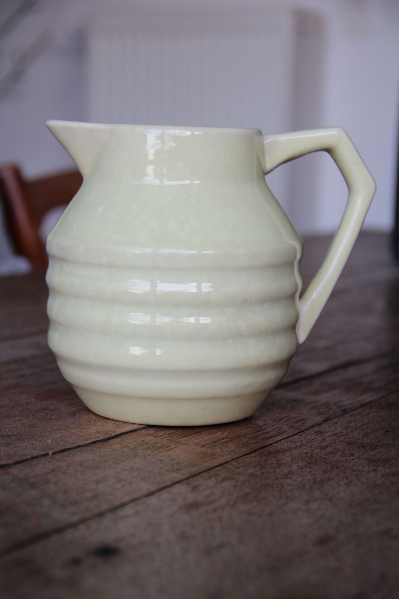 Art-deco pitcher in pale yellow earthenware
