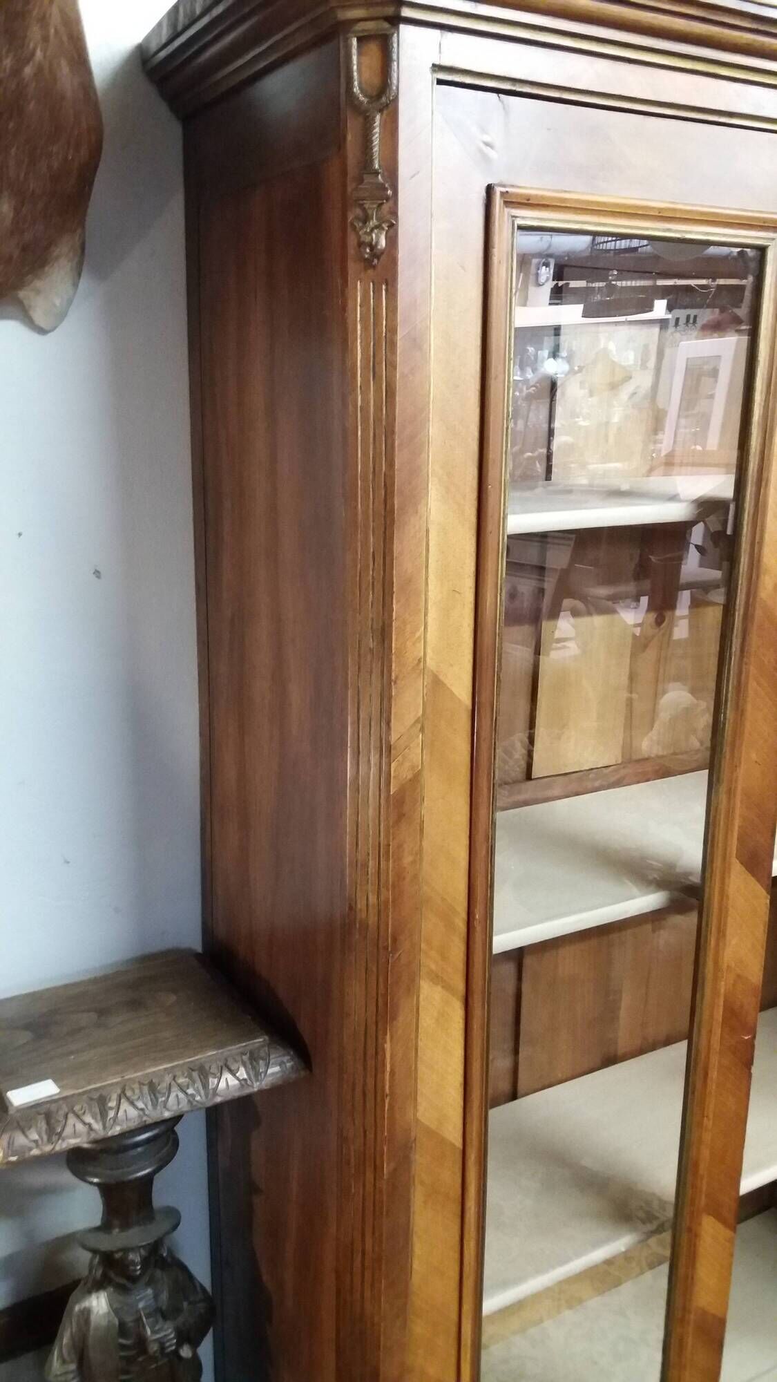 Two-door display cabinet in transitional style.