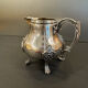 Antique silver-plated metal milk jug – Rococo style, chased decoration, early
