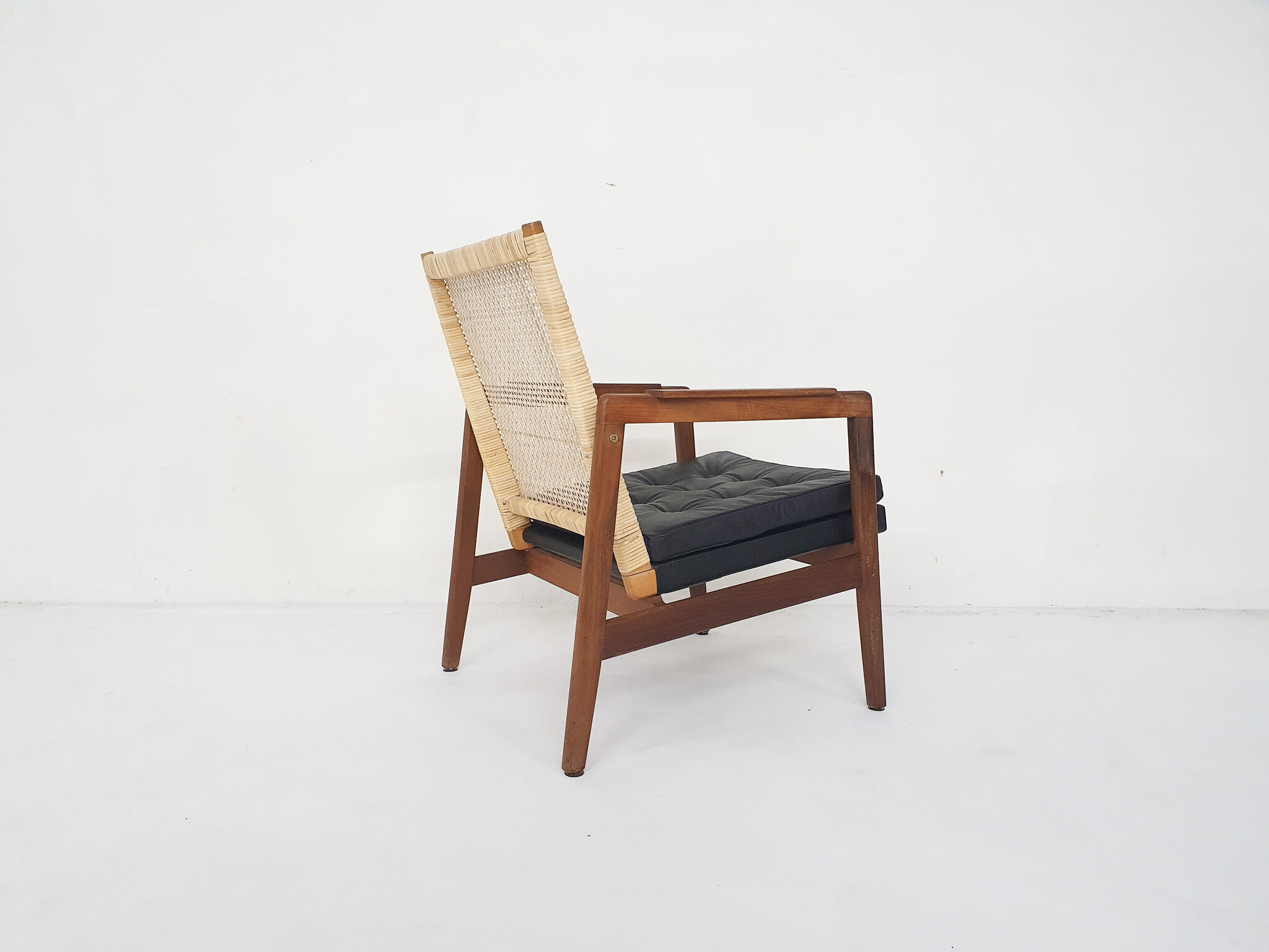 Rattan and leather low-back lounge chair by P.J. Muntendam for Gebr. Jonkers, The Netherlands 1950's