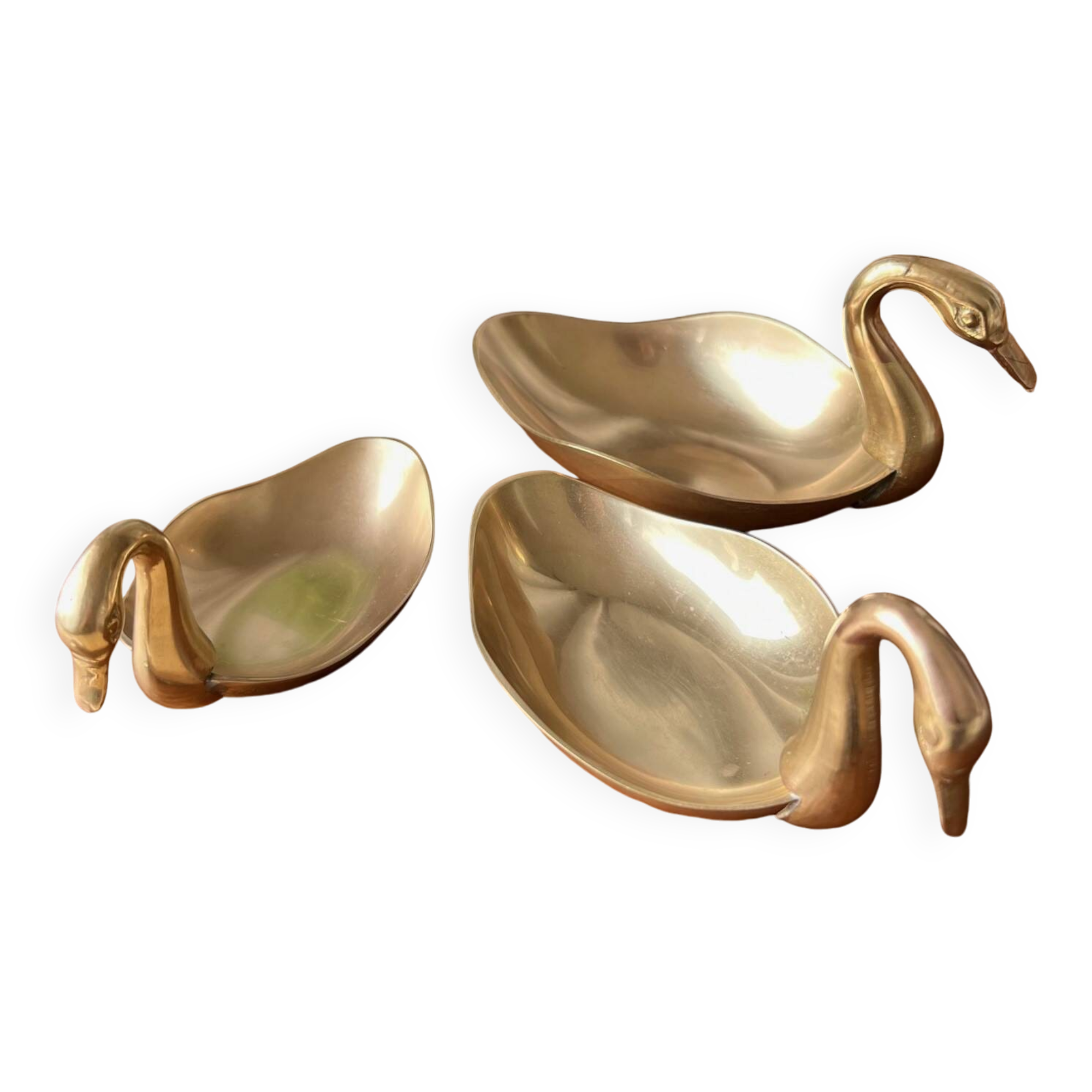 Trio of “swan” cups in gilded brass