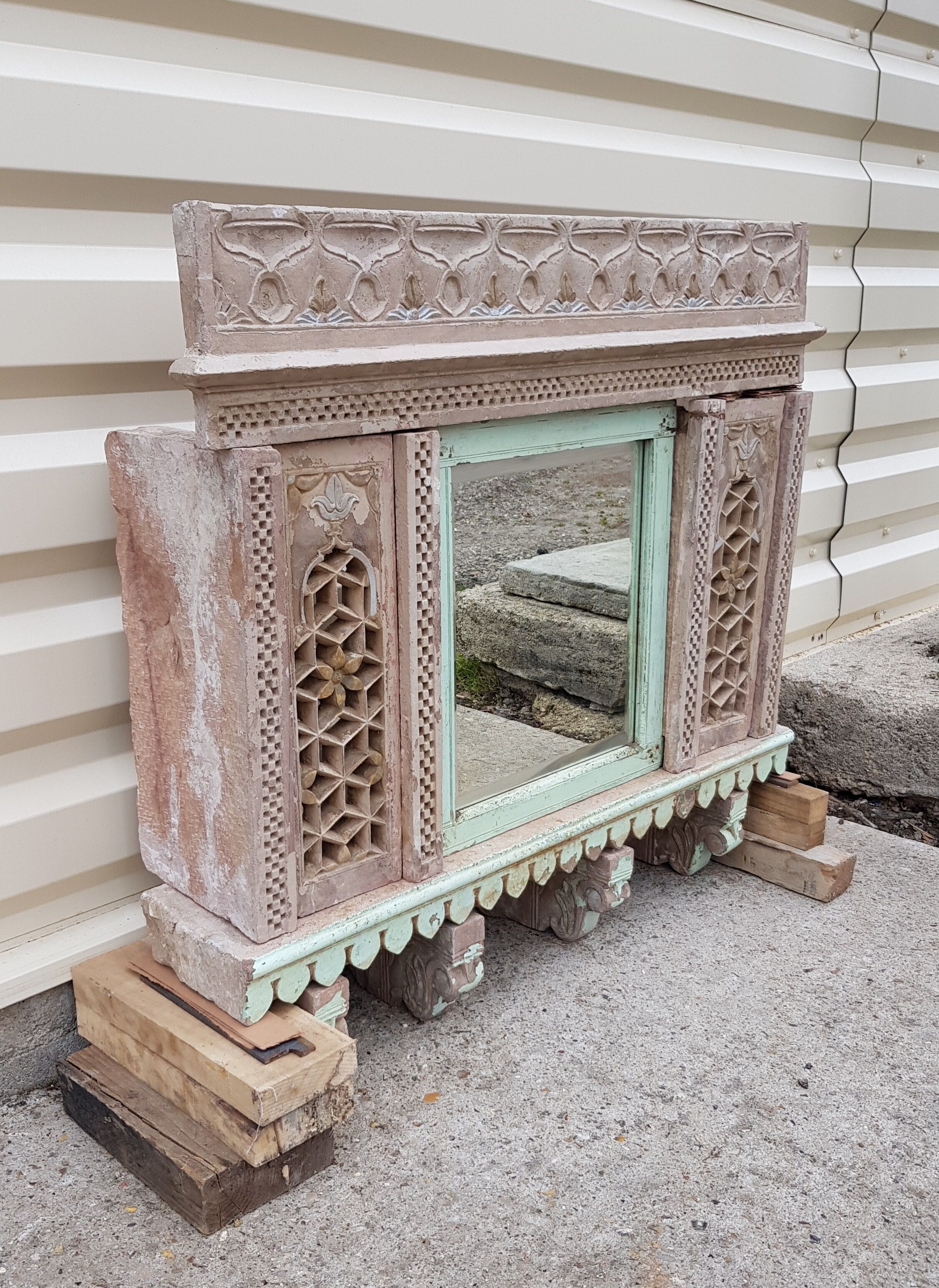 Fully hand-carved stone window with mirror