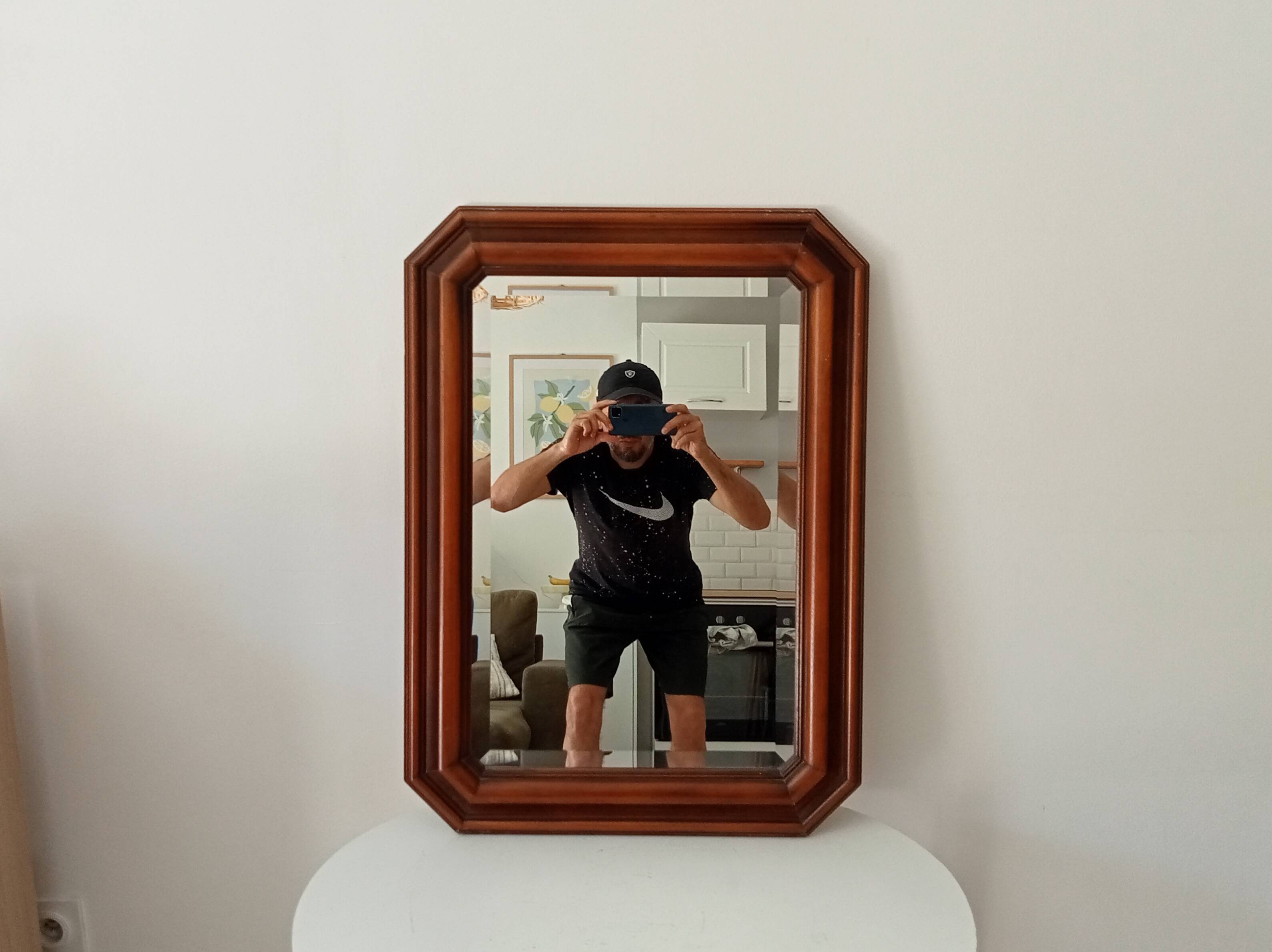 Vintage octagonal bevelled mirror from the 1960s.