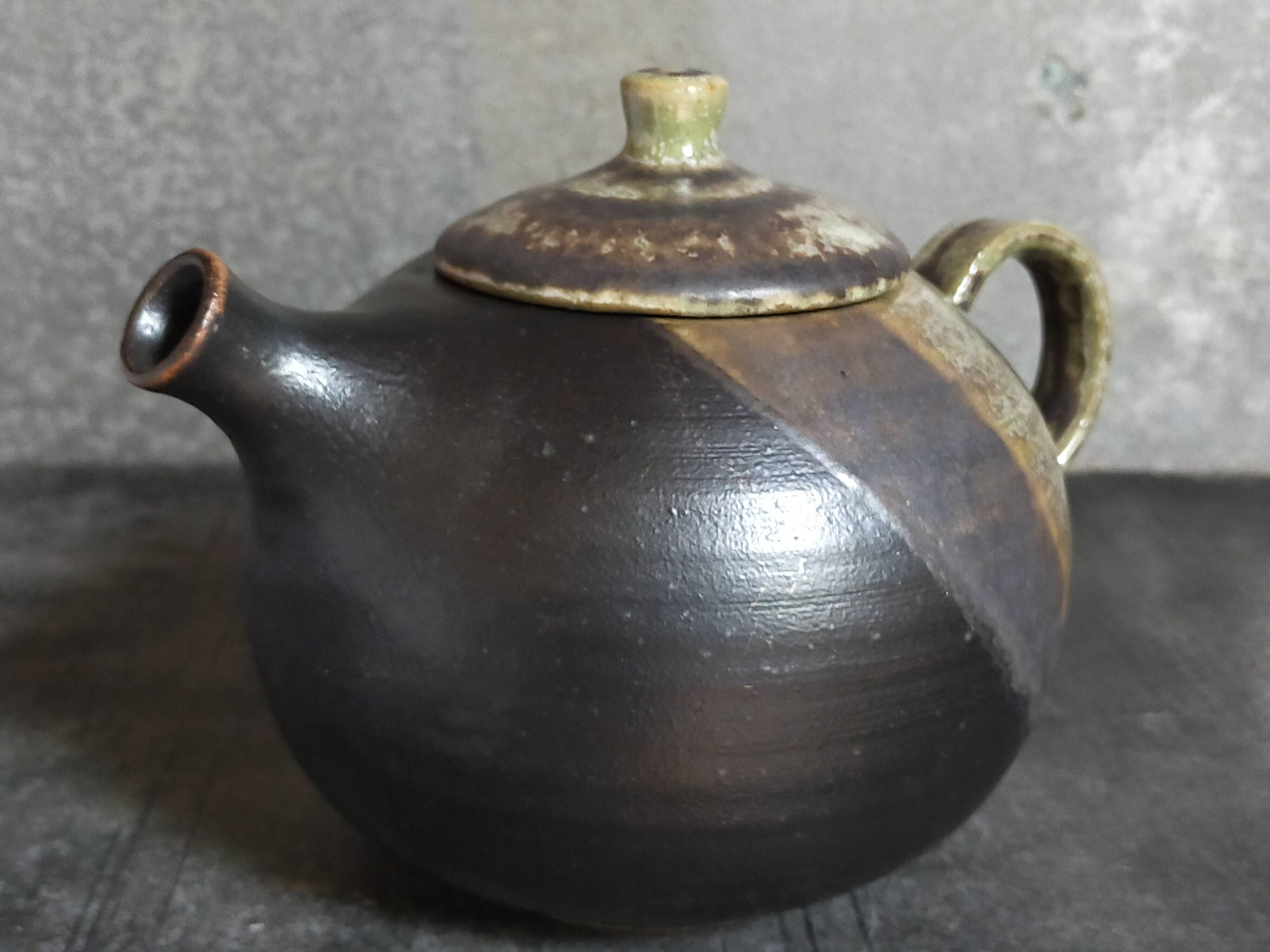 Vintage enameled stoneware potter's teapot