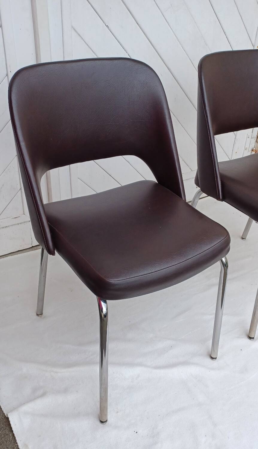 Pair of vintage faux leather and chrome armchairs
