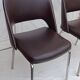 Pair of vintage faux leather and chrome armchairs
