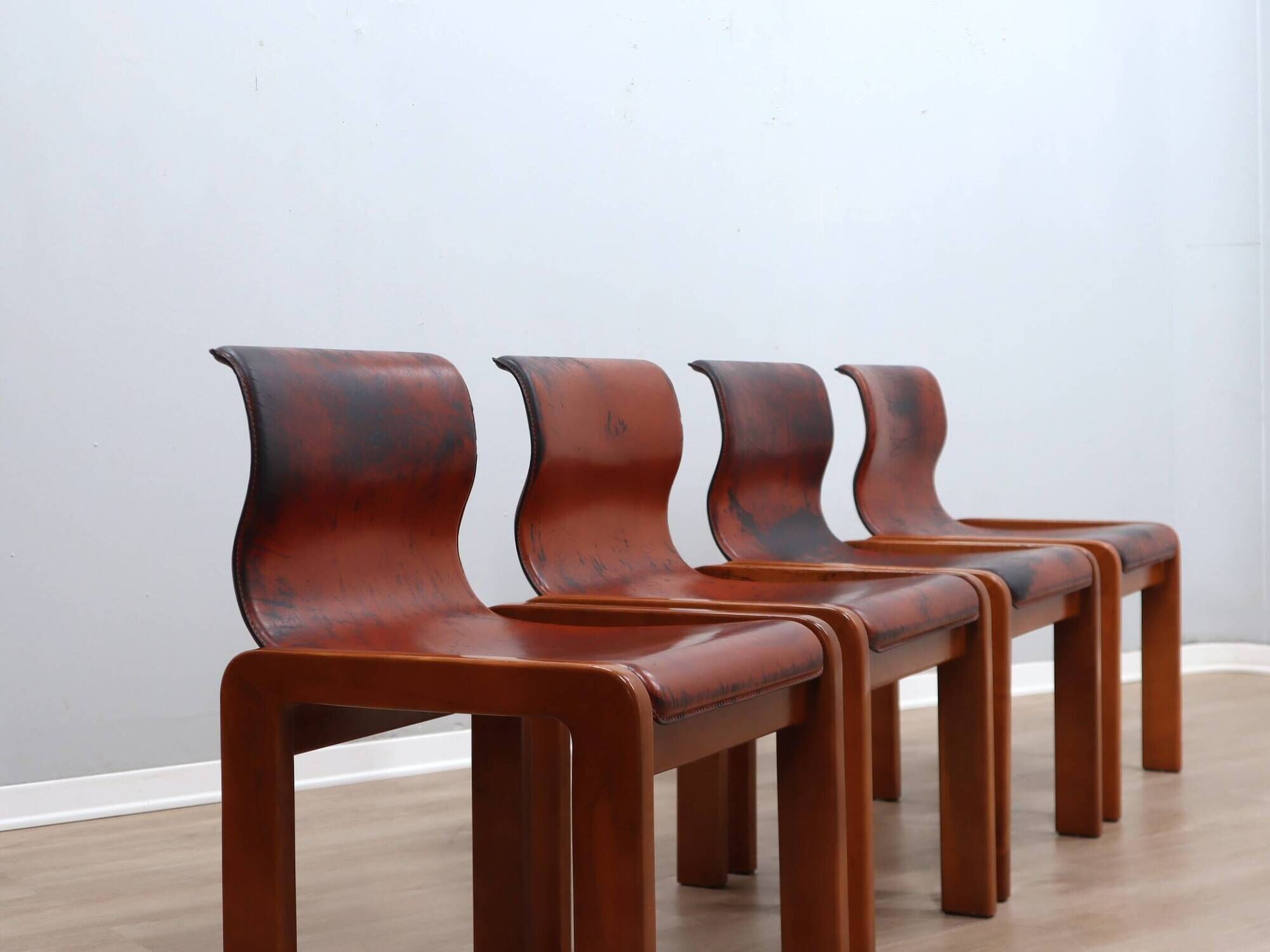 Curved wooden and leather chairs by Afra and Tobia Scarpa from the 1970s, set of 4.
