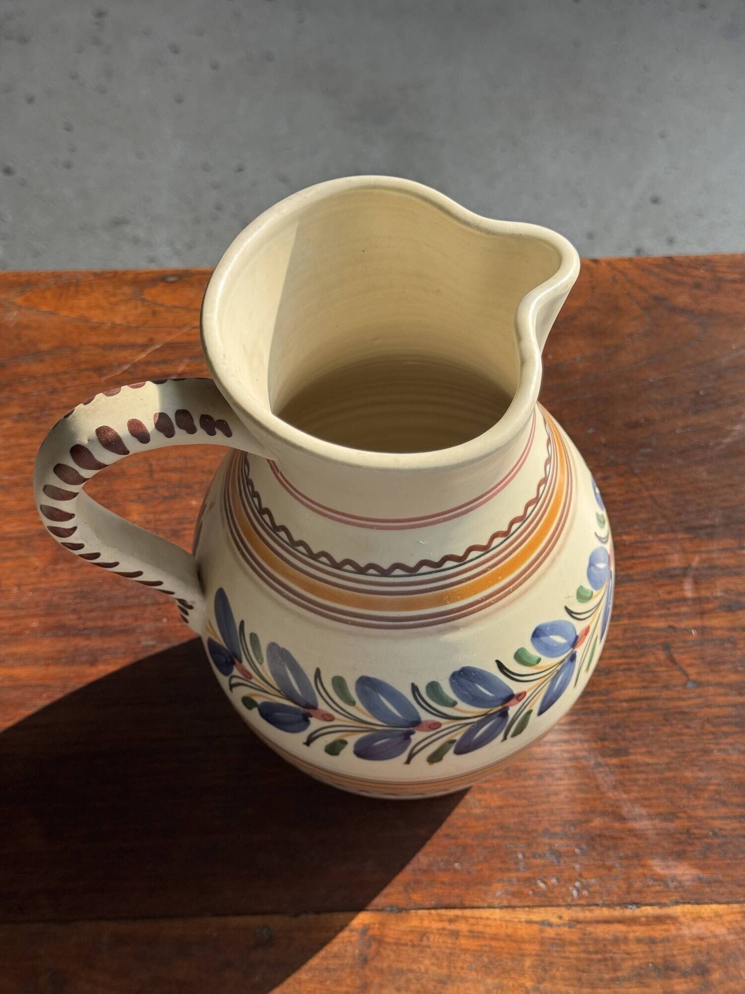 Beige carafe with stylized blue flower friezes