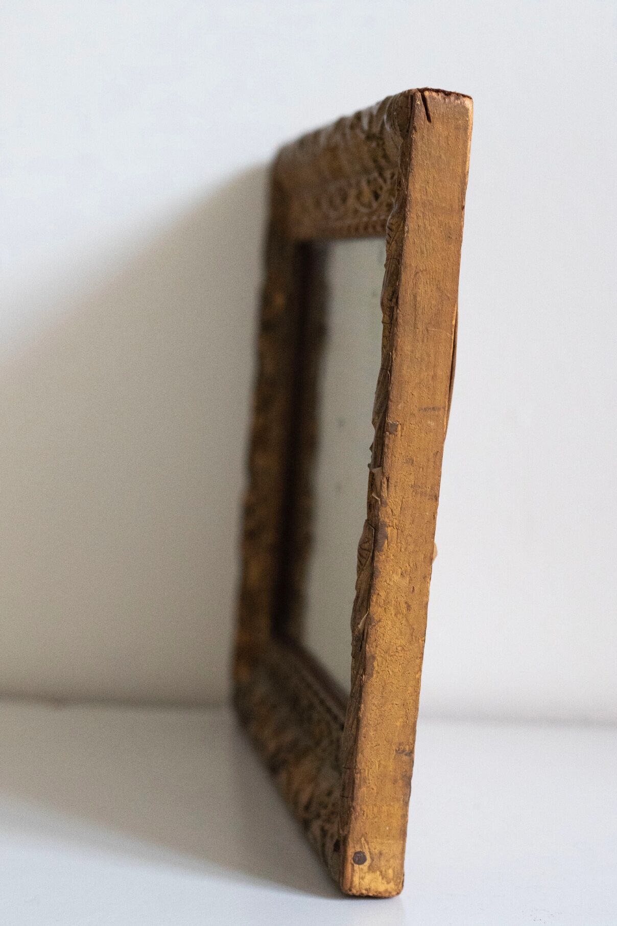 Antique mirror in gilded wood