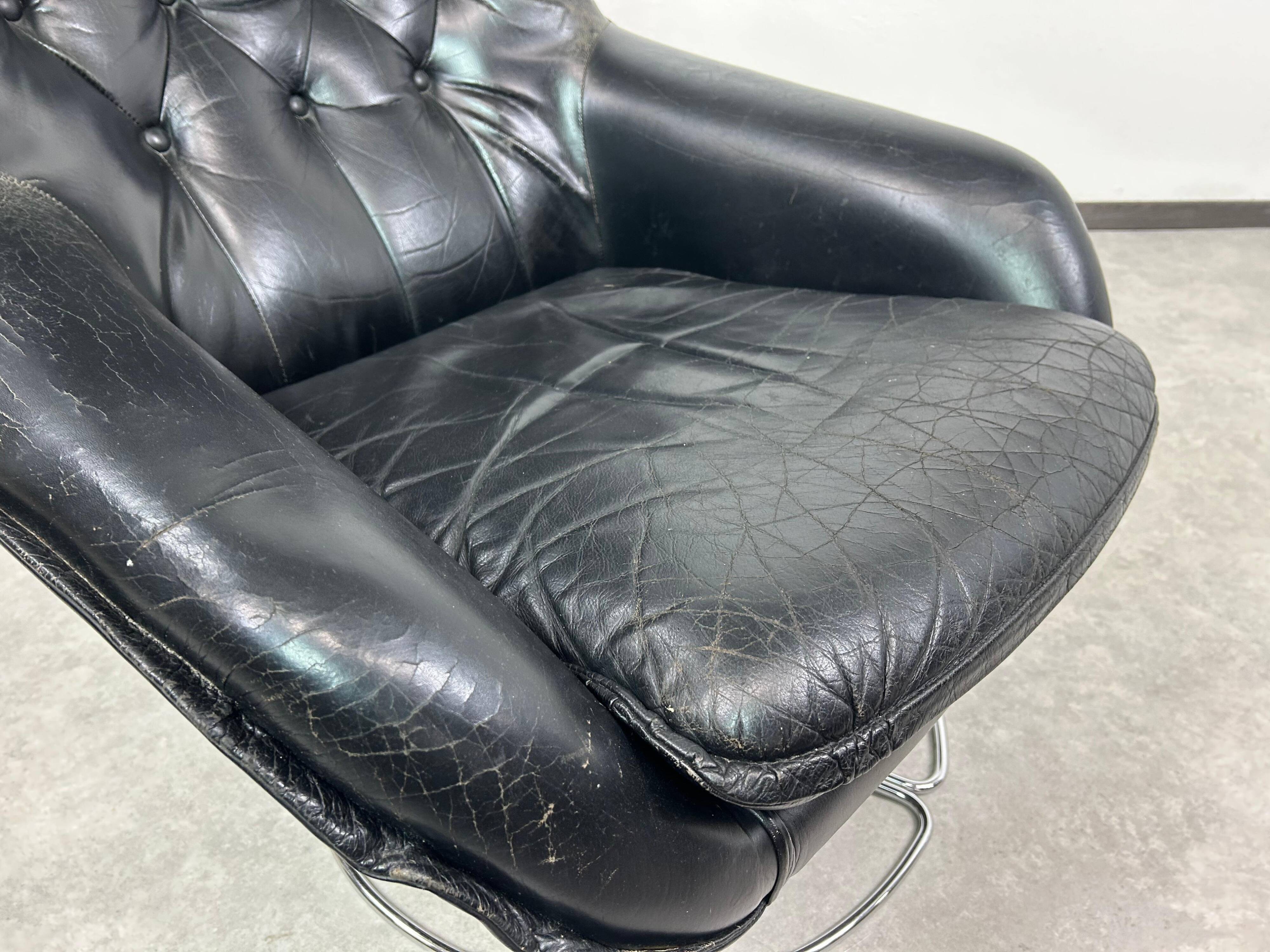 Black leather wingback swivel chair by PeeM