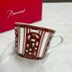 Pair of Baccarat Porcelain Coffee Cups and Saucers, Red Geometric Design