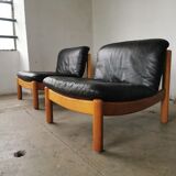 Pair of designer leather armchairs 80s