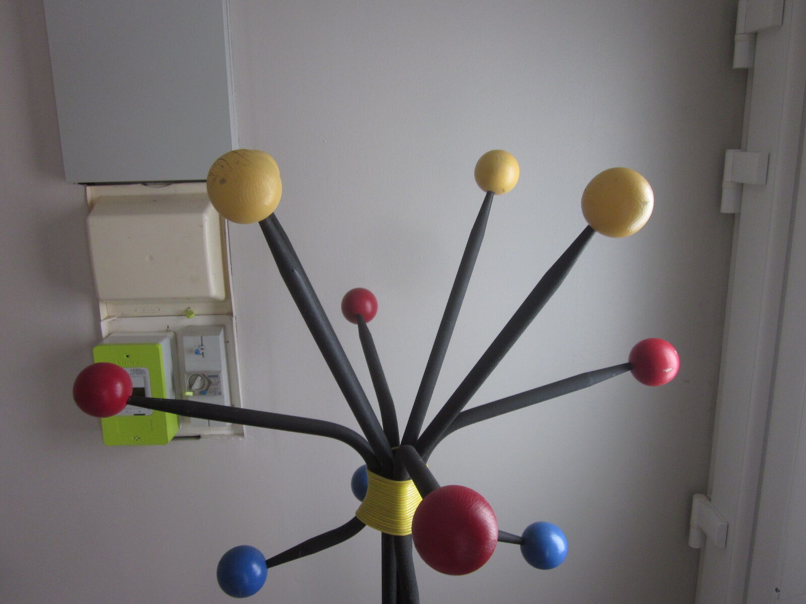 Vintage coat holder has 12 balls