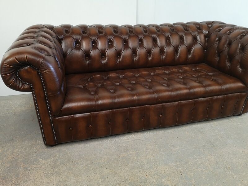 Light brown leather chesterfield sofa upholstered