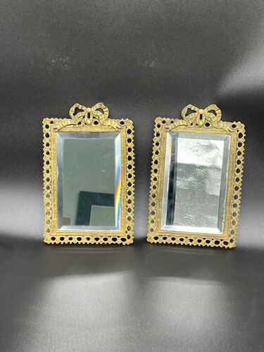 Paire de miroirs, laiton doré, verre biseauté, surmonté d'un nœud, ruban, style Louis XVI, finXIXème