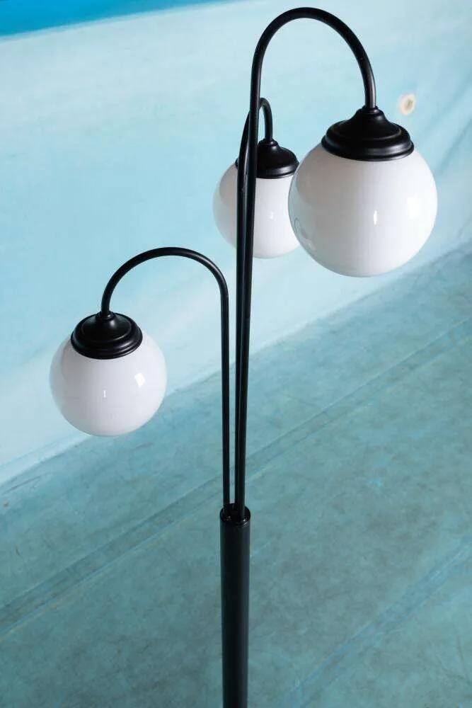Minimalist floor lamp in glass, space age style.