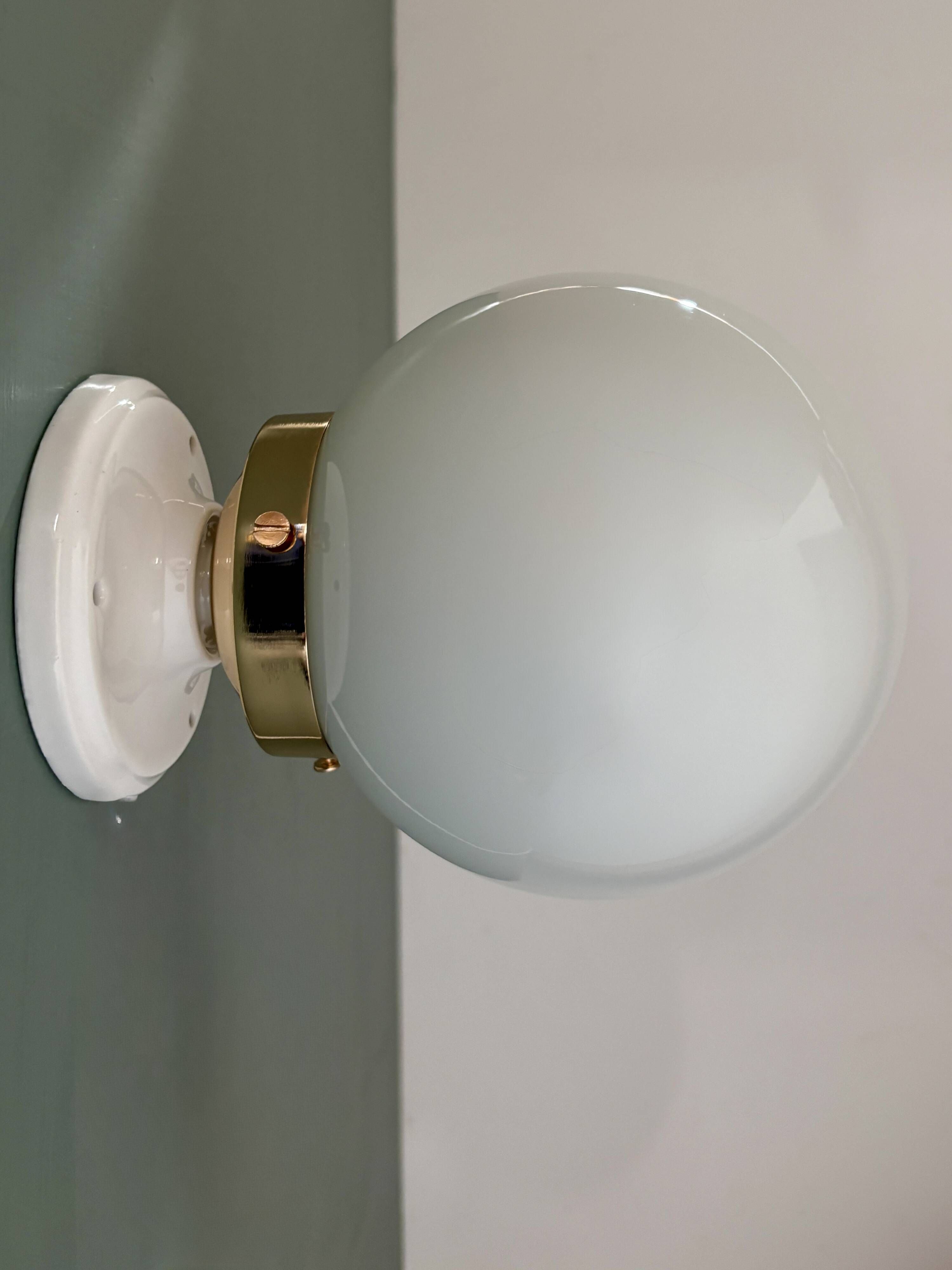 Vintage globe wall or ceiling light in white opaline.