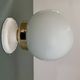 Vintage globe wall or ceiling light in white opaline.