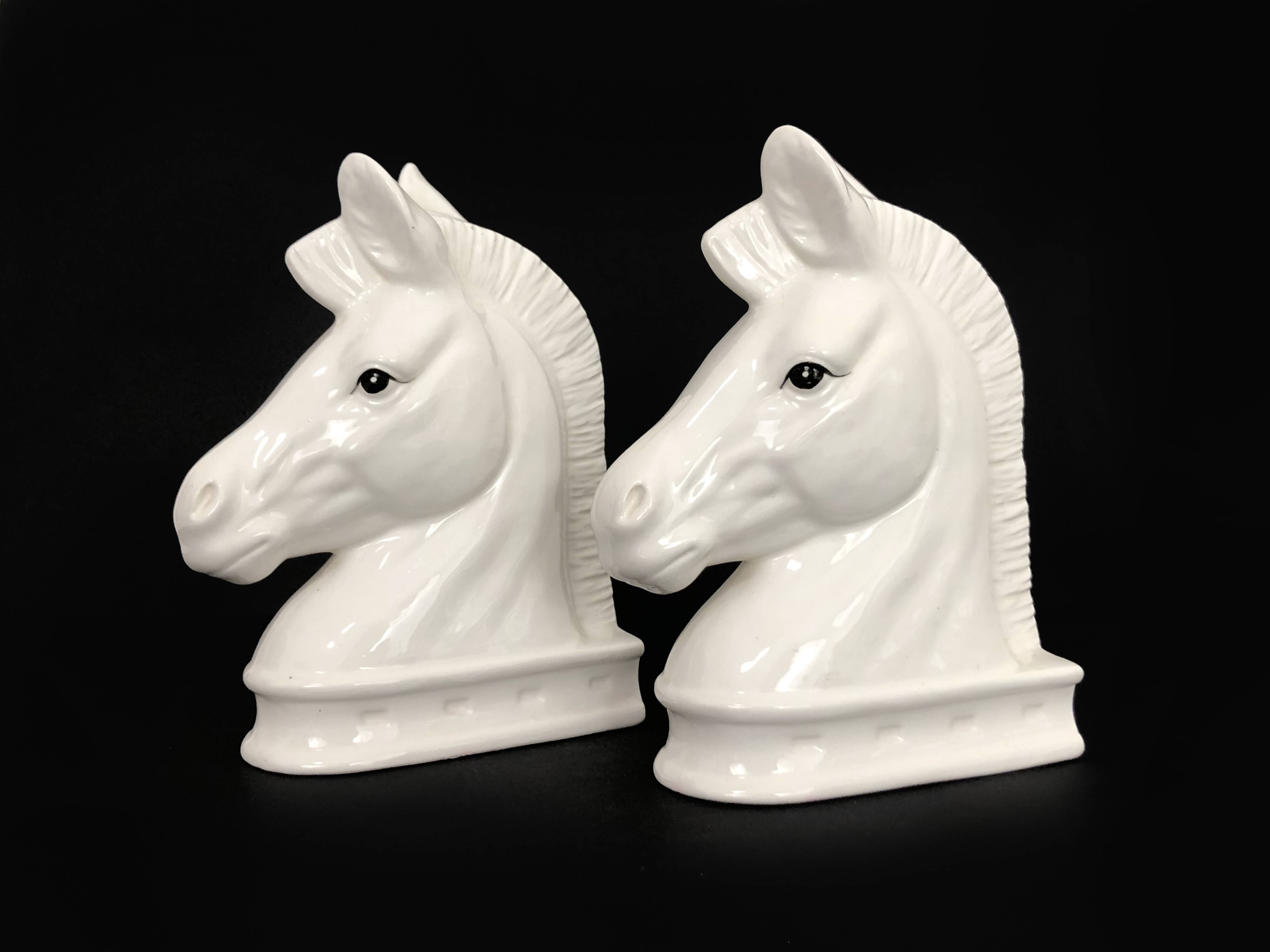 Pair of vintage white ceramic weighted horse bookends. 80 years