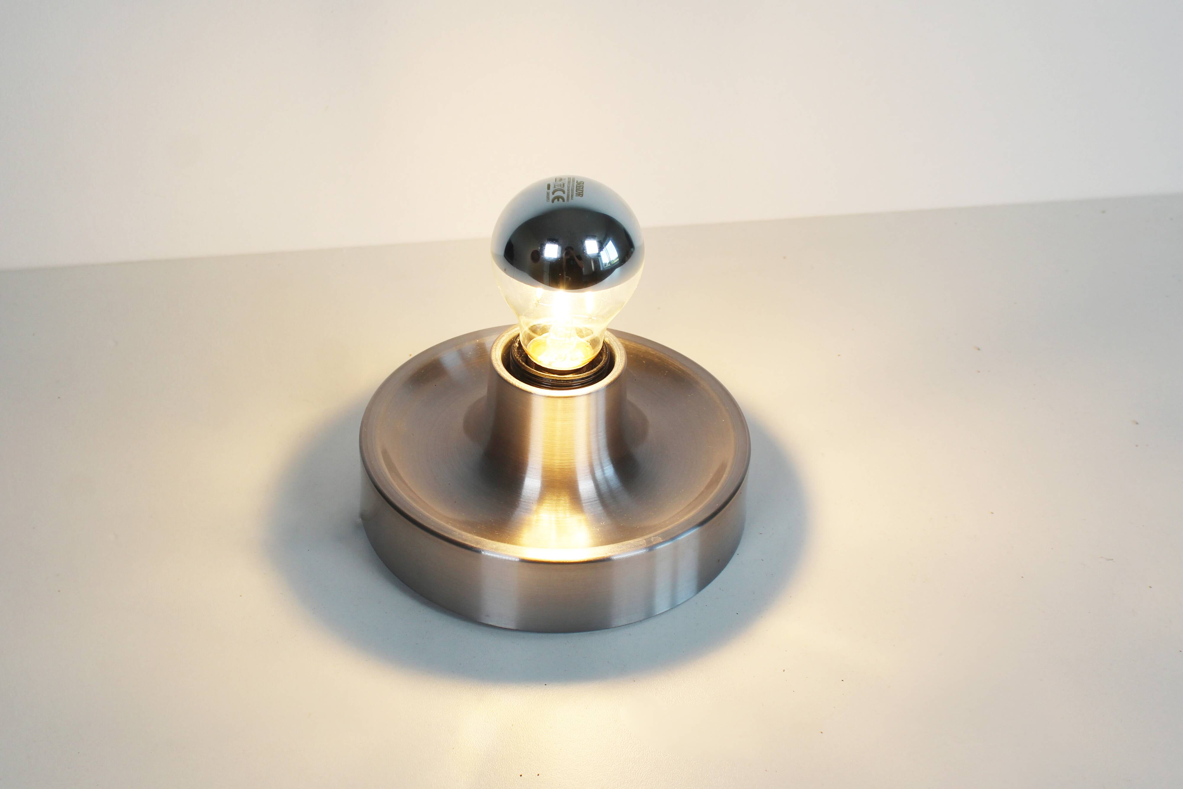 Pair of petite Disc sconces selected by Charlotte Perriand for Les Arcs