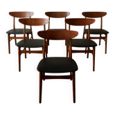 Chaises de salle à manger danoises vintage en teck, sièges en skai noir nouvellement rembourrés des années 1960.
