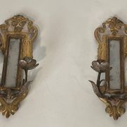 Pair of wall sconces in carved wood and silvered and gilded patinated metal with a central mirror.
